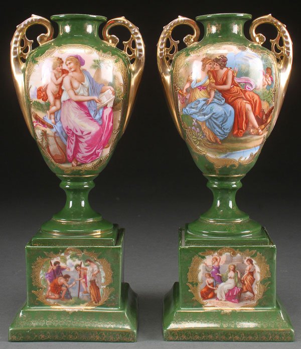 A PAIR OF SEVRÉS STYLE PORCELAIN PORTRAIT SCENE: A PAIR OF SEVRÉS STYLE PORCELAIN PORTRAIT SCENE URNS, CIRCA 1900. Each with romantic transfer scenes after Kaufman on a green ground with gilt decoration. Height 14.5 inches (36.5 cm).