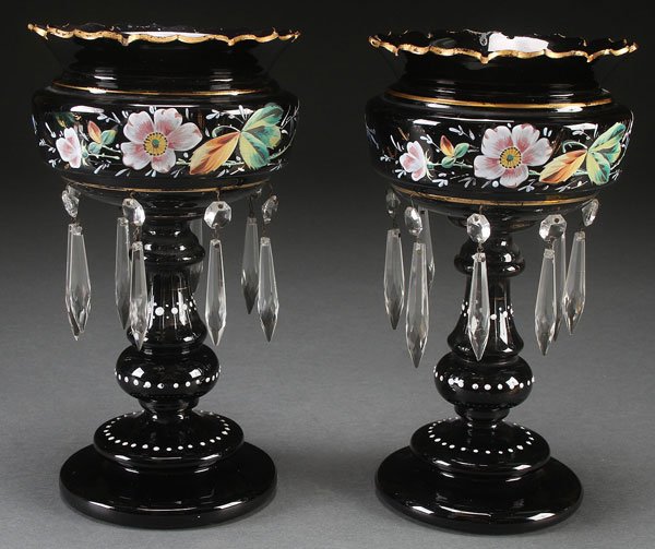 PAIR OF BOHEMIAN ENAMLED BLACK GLASS MANTLE LUSTE: PAIR OF BOHEMIAN ENAMLED BLACK GLASS MANTLE LUSTERS, LATE 19TH CENTURY. With hand painted florals and suspended prism pendants, one with some loss. Height 11 inches (28 cm).