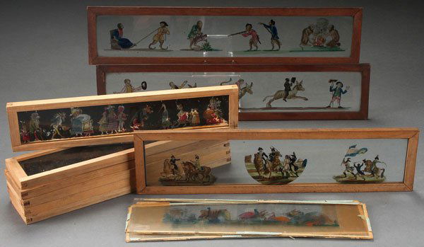 ELEVEN MOSTLY PHANTASMAGORIA MAGIC LANTERN SLIDES: ELEVEN MOSTLY PHANTASMAGORIA MAGIC LANTERN SLIDES, 19TH CENTURY. Polychrome and hand painted scenes, including punch and Judy type together with a three part military scene of Napoleon. 11.75 inches t