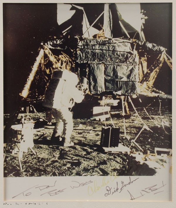A APOLLO 12 ASTRONAUTS SIGNED COLOR PHOTOGRAPH: A APOLLO 12 ASTRONAUTS SIGNED COLOR PHOTOGRAPH, CIRCA 1969. The color print of the Lunar Module Intrepid on the ocean of storms signed in lower margin “To Don Best Wishes, Charles Conrad, Dick Gordo