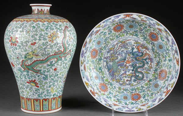 A PAIR OF CHINESE FAMILLE VERTE PORCELAIN PIECES: A PAIR OF CHINESE FAMILLE VERTE PORCELAIN PIECES. Each with dragons, interlocking florals, and vine. Comprising an ovoid vase and a low bowl, each with blue underglaze Kangxi mark. The tallest height 