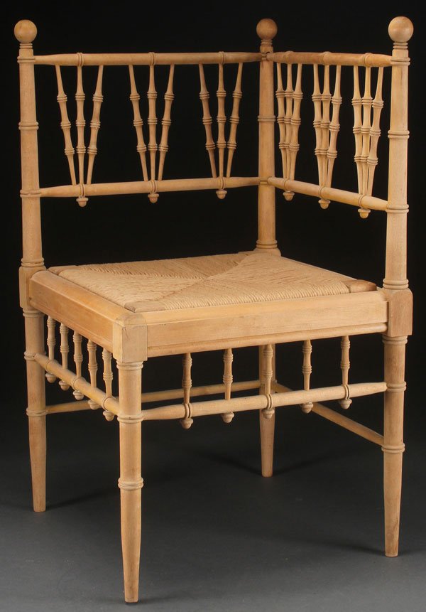 A VICTORIAN SPOOL TURNED MAPLE CORNER CHAIR: A VICTORIAN SPOOL TURNED MAPLE CORNER CHAIR. With woven rattan seat, the surface unfinished. Height 30 inches (76 cm).