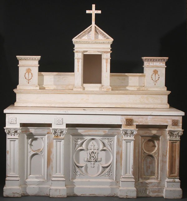 A FINE CARVED WOOD TWO PIECE CATHOLIC ALTAR: A FINE CARVED WOOD TWO PIECE CATHOLIC ALTAR, CIRCA 1890. Comprising a finely carved base with four columns upon which rests a tabernacle upper section with cross finial and opposing pedestals. Without