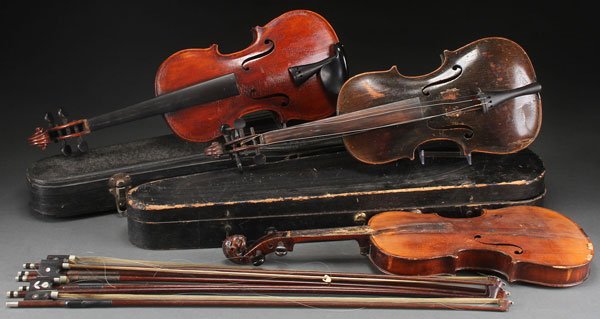 THREE VINTAGE VIOLINS, LATE 19TH EARLY 20TH CENTU: THREE VINTAGE VIOLINS, LATE 19TH EARLY 20TH CENTURY. Including one with a carved lion's head peg box terminal, together with six bows with mother of pearl inlay, one stamped "Tour le Model," in variou