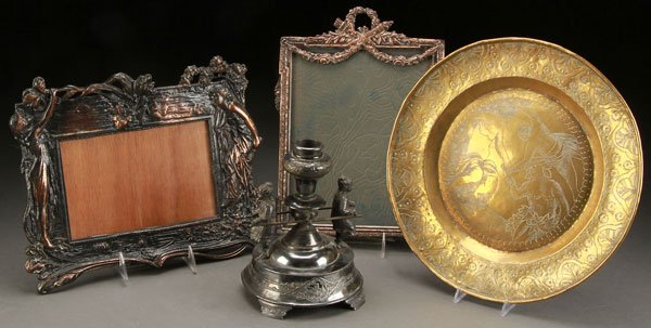 FOUR PIECE DECORATIVE METALWARES GROUP, 19TH/20TH: FOUR PIECE DECORATIVE METALWARES GROUP, 19TH/20TH CENTURY. Comprising a Victorian figural candle or vase holder, a reproduction Art Nouveau mirror, a silvered copper mirror frame, and a brass tray wit