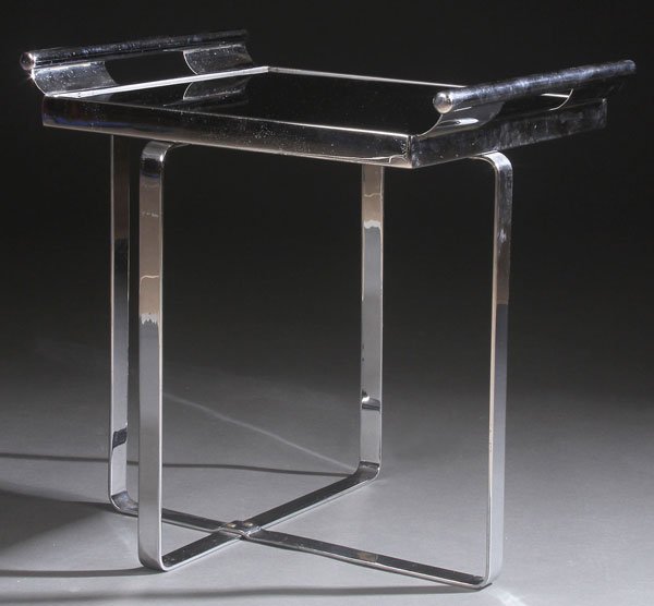 AN ART DECO PERIOD CHROME AND BLACK GLASS END: AN ART DECO PERIOD CHROME AND BLACK GLASS END TABLE/BUTLER'S STAND, CIRCA 1930'S. With removable tray, possibly Howell Manufacturing (a design by Wolfgang Hoffman).