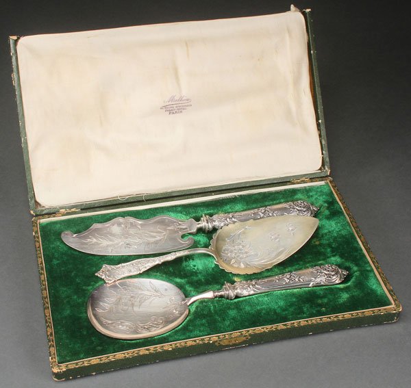 A FINE FRENCH CASED SILVER DESSERT SET, LATE 19TH: A FINE FRENCH CASED SILVER DESSERT SET, LATE 19TH CENTURY. Comprising a serving spoon and ice cream knife with finely tooled foliate and "C" scroll handles, each stamped with minerva head standard and