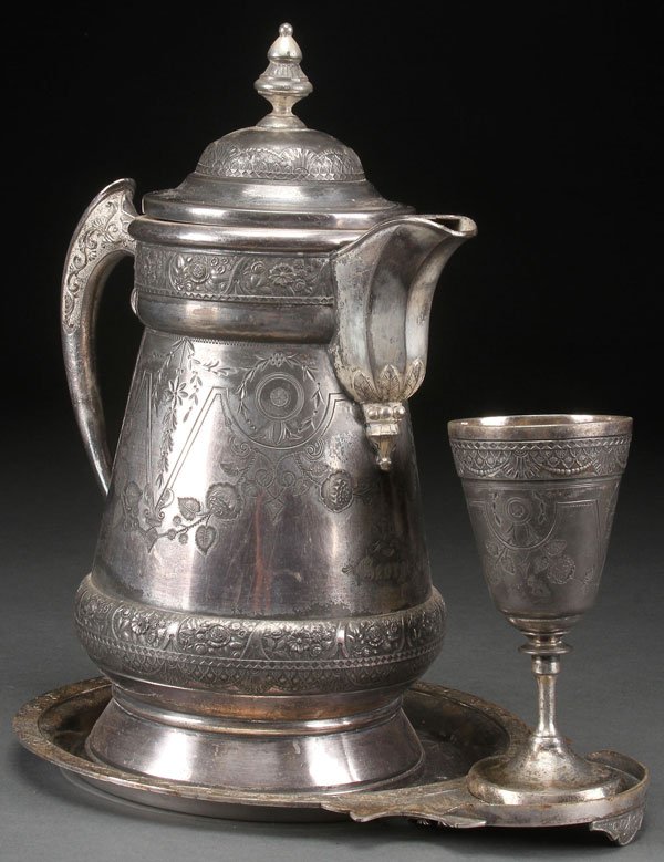 A VICTORIAN THREE PIECE ICE WATER SET. In quadrup: A VICTORIAN THREE PIECE ICE WATER SET. In quadruple plate, by Hall, Elton, & Co. comprising a porcelain lined pitcher, underplate, and matching goblet. Height 14.25 inches (36 cm).
