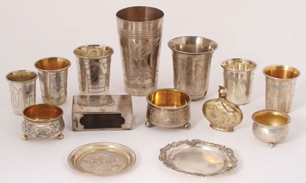 A 13-PIECE RUSSIAN SILVER GROUPING: A 13-PIECE RUSSIAN SILVER GROUPING, CIRCA 1850-1917. Comprising various silver engraved articles including a beaker, shot glasses, salts, trays, match box holder, and a later Soviet period perfume. Ea