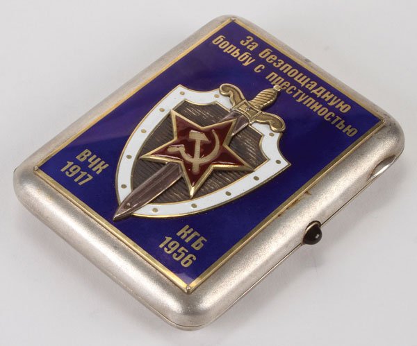 AN INTERESTING RUSSIAN SOVIET STATE SECURITY: AN INTERESTING RUSSIAN SOVIET STATE SECURITY (KGB) COMMEMORATIVE SILVER AND ENAMELED CIGARETTE CASE, MOSCOW, CIRCA 1956. The front of the hinged lid with enameled shield of the KGB emblazoned with the