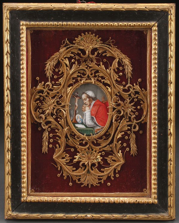 A VERY FINE GERMAN KLOSTERARBEITEN DEPICTING POPE: A VERY FINE GERMAN KLOSTERARBEITEN DEPICTING POPE LEO XII, CIRCA 1880. A hand-painted oval profile portrait of the Holy Father seated at a desk and praying before the crucifix and an image of Our Lady