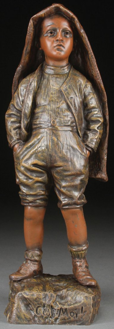 A BRONZE FIGURE OF A SULLEN YOUNG BOY, 19TH C: A BRONZE FIGURE OF A SULLEN YOUNG BOY, 19TH CENTURY. Depicting a young child with a sullen facial expression wearing a blanket upon his head. Inscribed "Bastiane" on base and inscribed "C'est Moi!" on