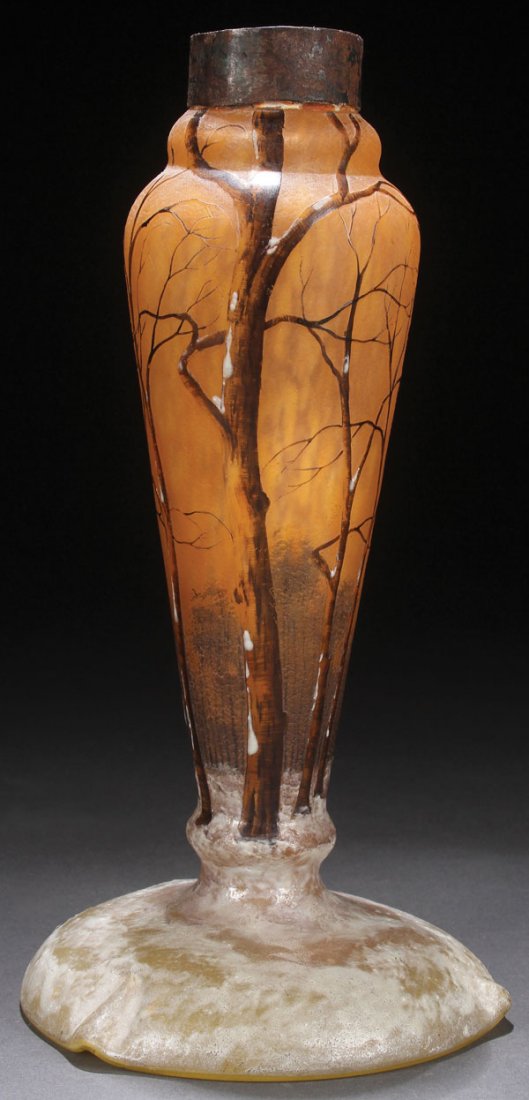 A DAUM NANCY FRENCH ENAMELED WINTER SCENE ART: A DAUM NANCY FRENCH ENAMELED WINTER SCENE ART GLASS LAMP BASE, EARLY 20TH CENTURY A baluster form with domed foot rim. Internally decorated with gray amber and yellow lemon glass. Cut with a design of