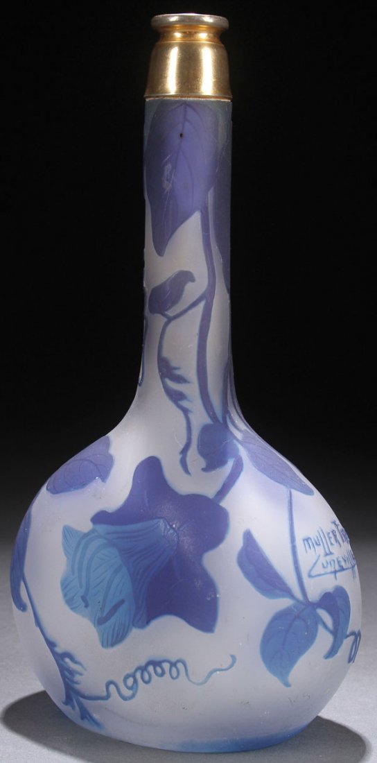 A MULLER FRES FRENCH CAMEO GLASS PERFUME BOTTLE: A MULLER FRES FRENCH CAMEO GLASS PERFUME BOTTLE, EARLY 20TH CENTURY. In gray-colored satin glass overlaid with blue and cut with clematis vines and flowers. Signed in cameo "Muller Fres Loneville." Th