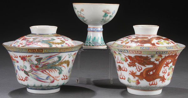 A PAIR OF CHINESE FAMILLE ROSE PORCELAIN COVERED: A PAIR OF CHINESE FAMILLE ROSE PORCELAIN COVERED WINE CUPS, GUANGXU MARK AND PERIOD. The thinly walled porcelain with gently sloping sides decorated with an enameled phoenix and dragon in red oxide an