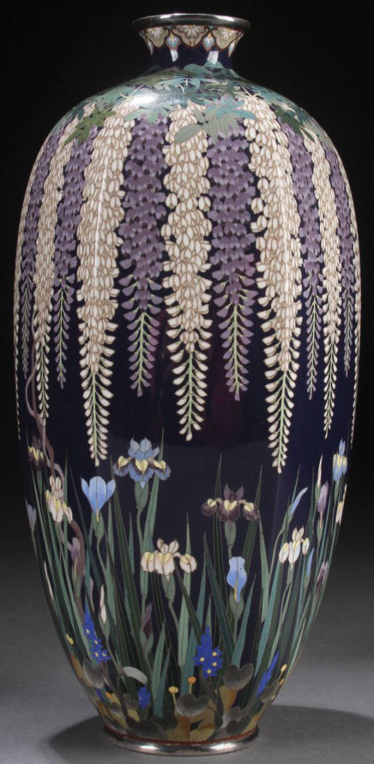 A VERY FINE JAPANESE CLOISONNÉ ENAMELED BRONZE: A VERY FINE JAPANESE CLOISONNÉ ENAMELED BRONZE AND SILVER MOUNTED VASE, MURASE JINSABURO WORKSHOP, MEJI PERIOD, CIRCA 1890. Of ovoid six panel form, decorated with cascading wisteria above irises on