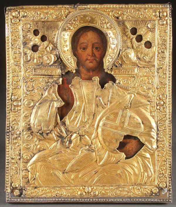 A RUSSIAN ICON OF CHRIST, 18TH CENTURY.: A RUSSIAN ICON OF CHRIST, 18TH CENTURY. Painted in the Italianate style, Christ holds an orb with cross finial and delivers a blessing. Overlaid with a gilded silver repoussé riza. Hallmarked Moscow