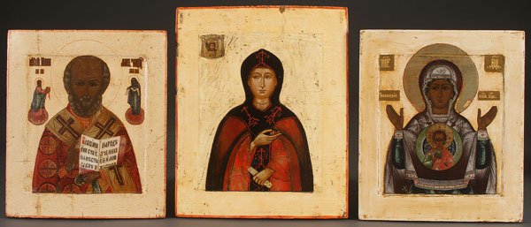 A GROUP OF THREE RUSSIAN ICONS, 19TH CENTURY.: A GROUP OF THREE RUSSIAN ICONS, 19TH CENTURY. Comprising Saint Nicholas, probably Saint Evdokia and the Sign Mother of God. The borders and background cleaned down to the gesso. Greatest size 13.75 in