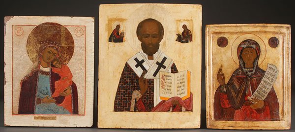 A GROUP OF THREE RUSSIAN ICONS, 18TH AND 19TH C.: A GROUP OF THREE RUSSIAN ICONS, 18TH AND 19TH CENTURY. Comprising a Russian icon the Mother of God, Saint Nicholas, and Saint Paraskeva. The backgrounds and borders cleaned down to the gesso. Largest 