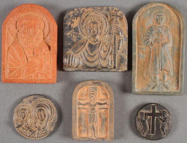 6 BYZANTINE-STYLE CARVED STONE STELE ICONS: A GROUP OF SIX BYZANTINE-STYLE CARVED STONE STELE ICONS, 19TH OR 20TH CENTURY. Comprising a carved figure of Saint Peter in arched reserve, a waist-up portrait of Christ in black stone, a full-figured