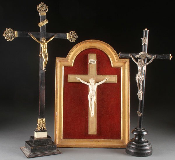 A GROUP OF THREE FRENCH CRUCIFIXES, 19TH CENTURY: A GROUP OF THREE FRENCH CRUCIFIXES, 19TH CENTURY. The first set with a gilt bronze Corpus Christi set on an ebonized wood frame, with pierced bronze terminating cross ends, set on a stepped base, over