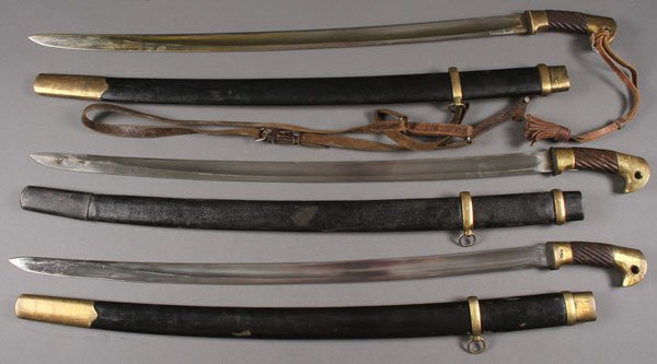 GROUP OF THREE RUSSIAN SHASHKAS, WORLD WAR II: GROUP OF THREE RUSSIAN SHASHKAS, WORLD WAR II. Each with scabbard and each with war dated blades.