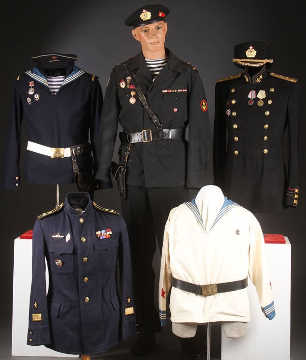 A GROUP OF RUSSIAN SOVIET NAVAL UNIFORMS: A GROUP OF RUSSIAN SOVIET NAVAL UNIFORMS, CIRCA 1940-1985. Including Officer’s summer service tunic, enlisted man’s summer pull-over, and an enlisted man’s blue jumper with dress collar, belt an