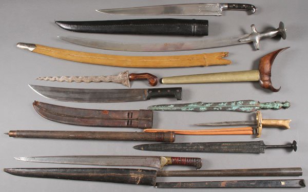 EIGHT SWORDS AND OTHER EDGED WEAPONS: AN INTERESTING GROUP OF EIGHT SWORDS AND OTHER EDGED WEAPONS, 19TH AND 20TH CENTURY. Comprising a variety of various edged weapons representing numerous cultures. Including Africa, India and the far E