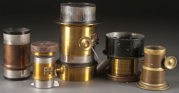 FOUR 19TH CENTURY BRASS BARREL PROJECTION LENSES: FOUR 19TH CENTURY BRASS BARREL PROJECTION LENSES. Comprising an "A.J. Thompson, Boston" (diameter 4.5 inches), a "Steinheil-Munich, Anastigmat" (diameter 4.25 inches), a "McIntosh Steropticon Co" (dia