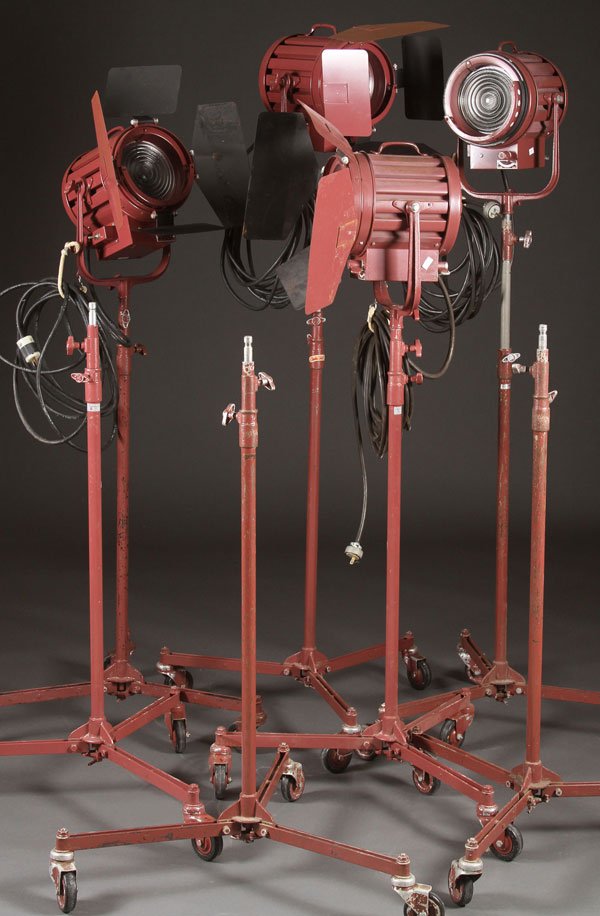 A SET OF FOUR MOLE-RICHARDSON BABY SOLARSPOT: A SET OF FOUR MOLE-RICHARDSON BABY SOLARSPOT, MID 20TH CENTURY. Type 751 on stands. Three with adjustable barn doors, together with three additional adjustable stands. The largest height as illustrate