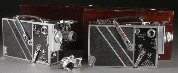 TWO CINE-KODAK SPECIAL MOTION PICTURE CAMERAS: TWO CINE-KODAK SPECIAL MOTION PICTURE CAMERAS. Each lens turret mounted with a single 1.9/25mm Anastigmat lens, and each contained in a fitted hardwood case, together with an extra 1.9/25mm lens.