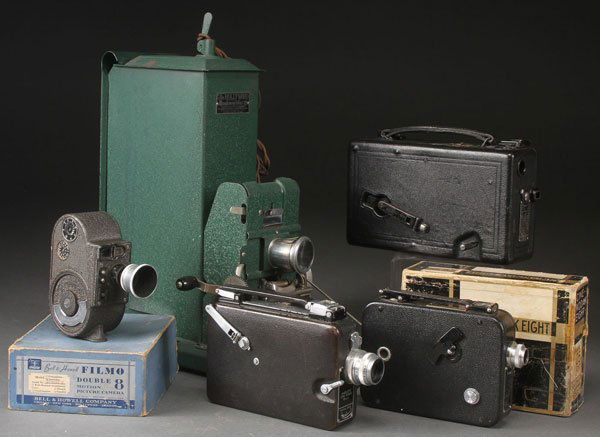 A VINTAGE MOTION PICTURE CAMERA AND PROJECTOR: A VINTAGE MOTION PICTURE CAMERA AND PROJECTOR GROUP, CIRCA 1930S. Comprising a Cine Kodak Model B-16mm, a Filmo Sportster double run-eight, a Cine Kodak 8mm model 25 and "Magazine" cameras and a Montg