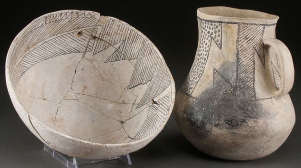 CHACO BLACK ON WHITE POTTERY BOWL AND JUG: A PRE HISTORIC CHACO BLACK ON WHITE POTTERY BOWL AND JUG, ANASAZI, A.D. 1050-1200. Each with geometric designs. Some restorations. Jug height 8 inches, bowl diameter 9.5 inches.
