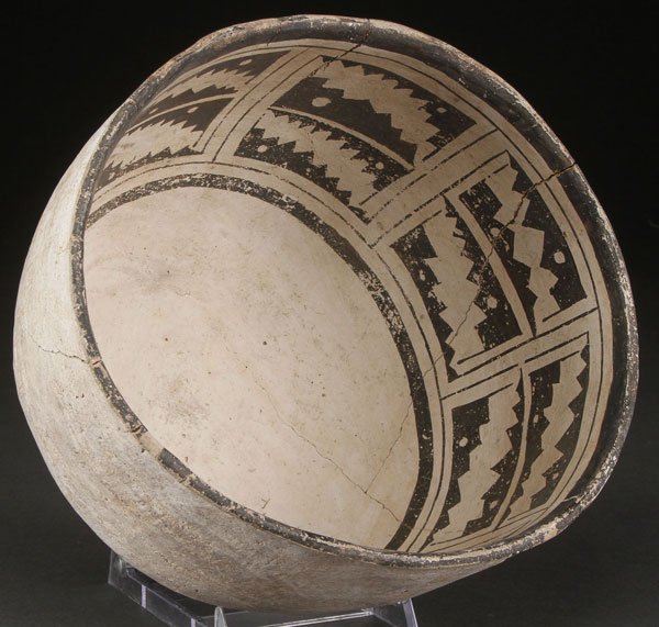 A FINE PRE HISTORIC POTTERY BOWL, ROOSEVELT: A FINE PRE HISTORIC POTTERY BOWL, ROOSEVELT, SALADO, A.D. 1275-1330. The interior with multiple diagonal sawtooth panels. Some restorations, 10 inches diameter.