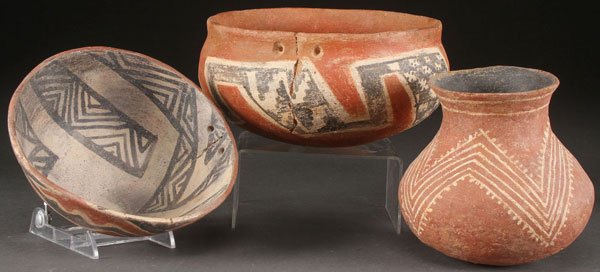 THREE PRE HISTORIC POTTERY VESSELS, SALADO: THREE PRE HISTORIC POTTERY VESSELS, SALADO, A.D. 1300-1450. Comprising a small olla and two bowls with pierced suspension poles. The largest diameter 8 inches.