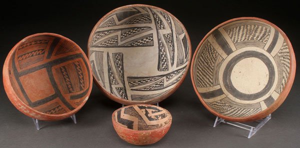 FOUR PRE HISTORIC PINTO AND GILA POTTERY: FOUR PRE HISTORIC PINTO AND GILA POLYCHROME POTTERY BOWLS. Of various size. The largest two with black on white interiors. The smaller two with black on red interiors. Some with restorations and the l