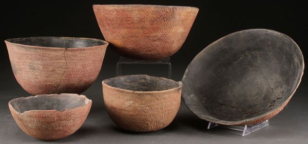 A GROUP OF FIVE PRE HISTORIC RED POTTERY BOWLS: A GROUP OF FIVE PRE HISTORIC RED POTTERY BOWLS, SALADO, A.D. 1200-1400. The largest 10.75 inches.