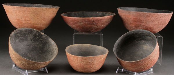 A GROUP OF SIX PRE HISTORIC RED POTTERY BOWLS: A GROUP OF SIX PRE HISTORIC RED POTTERY BOWLS, SALADO, A.D. 1200-1400. The largest diameter 9.625 inches.