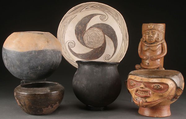 SIX ANCIENT POTTERY REPLICA VESSELS: SIX ANCIENT POTTERY REPLICA VESSELS. Including a seated Mayan figure of sculpted form with carved scenic panel. The largest diameter 13.5 inches