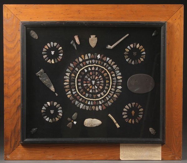 A GOOD COLLECTION OF STONE ARTIFACTS: A GOOD COLLECTION OF STONE ARTIFACTS AND PROJECTILES. Over 175 pieces of various size and style. All attractively framed including numerous points, a bone whistle, drill bits, and other items. The lar