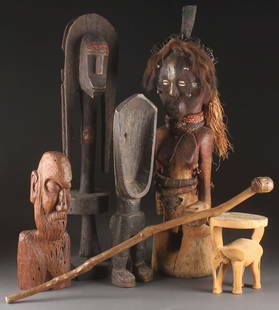 A FOUR PIECE GROUP OF AFRICAN CULTURE WOOD CARVING: A FOUR PIECE GROUP OF AFRICAN CULTURE WOOD CARVINGS, 20TH CENTURY. Comprising a large Senufo figural double headed rhythm pounder, a two legged shovel head figure, a possibly Malaysian coast standing