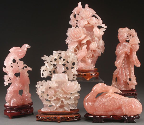 A FIVE PIECE GROUP OF CHINESE CARVED ROSE QUARTZ: A FIVE PIECE GROUP OF CHINESE CARVED ROSE QUARTZ FIGURES AND URNS, LAST HALF OF THE 20TH CENTURY. Comprising a large lidded urn with floral blossoms and birds, a reticulated prunus and bird lidded urn