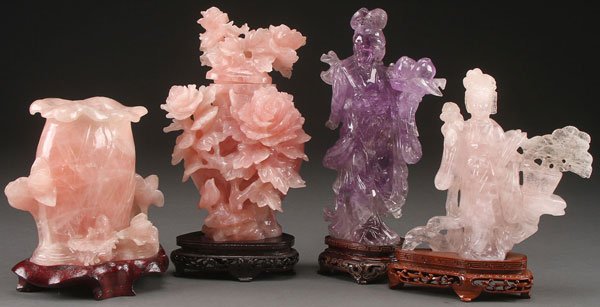 A FOUR PIECE GROUP OF CHINESE CARVED ROSE QUARTZ: A FOUR PIECE GROUP OF CHINESE CARVED ROSE QUARTZ AND AMETHYST, LAST HALF OF THE 20TH CENTURY. Comprising a cabbage form and floral brush pot, a prunus and bird form lidded urn, a standing Kwan Yin (re