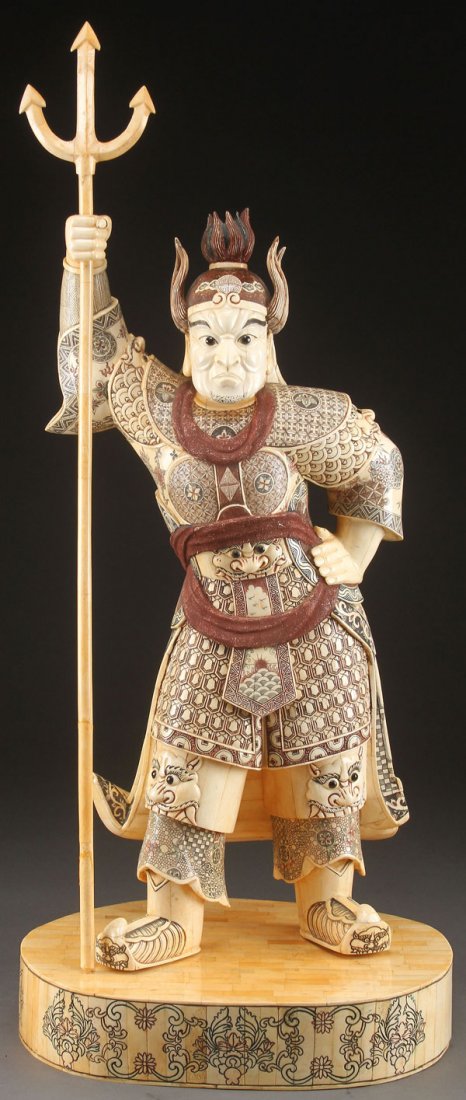 IMPRESSIVE ORIENTAL CARVED BONE WARRIOR: A LARGE AND IMPRESSIVE ORIENTAL CARVED BONE WARRIOR FIGURE, LAST HALF OF THE 20TH CENTURY. In the form of a standing figure in armor with trident spear and incised carved polychrome details. Height to
