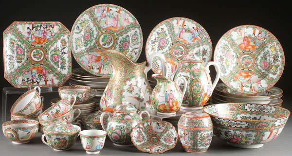 AN ASSEMBLED SET OF CHINESE ROSE MEDALLION: AN ASSEMBLED SET OF CHINESE ROSE MEDALLION PORCELAIN DINNERWARE, EARLY 20TH CENTURY. Sixty-three pieces comprising a large milk pitcher, various sized plates, bowls, a three-piece tea set, tea cups, a