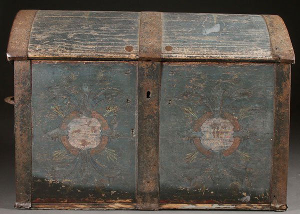 A NORWEGIAN POLYCHROME FOLK ART WOOD TRUNK: A NORWEGIAN POLYCHROME FOLK ART WOOD TRUNK, 19TH CENTURY. With floral decorated panels and eight point polychrome stars on a faded dark blue ground. The dome top lid interior with painted pastoral sc