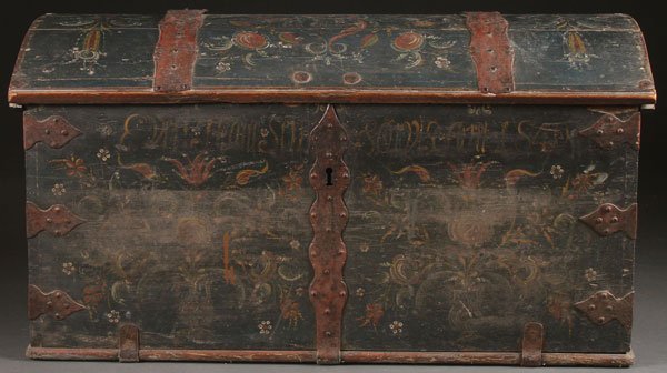 A FINE NORWEGIAN POLYCHROME WOOD TRUNK: A FINE NORWEGIAN POLYCHROME WOOD TRUNK, MID 19TH CENTURY. With all over floral decoration on a dark blue ground and with ornate cut iron strap work surmounting the wood domed cover above a name and da