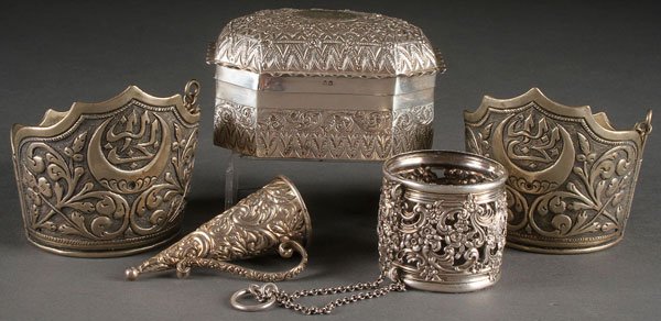 A FIVE PIECE GROUP OF 19TH CENTURY SILVER: A FIVE PIECE GROUP OF 19TH CENTURY SILVER. Comprising a pair of Turkish silver cuffs, a Birmingham repousse and chased lidded box (1885), a small comical handled cup and a reticulated silver collar on