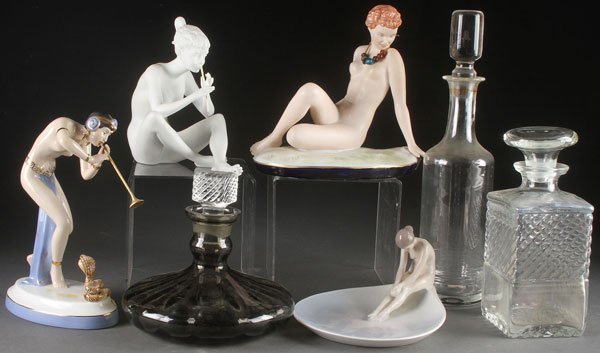 A GROUP OF FOUR PORCELAIN NUDE FIGURES: A GROUP OF FOUR PORCELAIN NUDE FIGURES, 20TH CENTURY. Comprising a Royal Dux “Snake Charmer”, a Kaiser flutist, a Royal Dux posing nude, a B & G figural nude handled tray, together with three glas