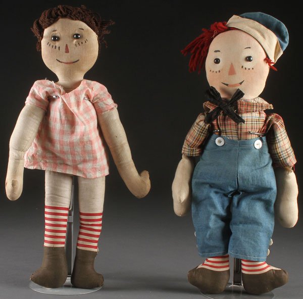 TWO PF VOLLAND RAGGEDY ANN AND ANDY DOLLS: TWO PF VOLLAND RAGGEDY ANN AND ANDY DOLLS, EARLY 20TH CENTURY. Comprising a very early Ann doll with painted features, button eyes, and heart shape in chest, and a later Andy doll with printed feature